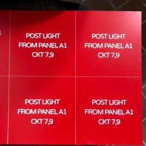 Laser engraved number plates with white letters on red