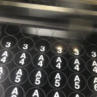 Number plates being laser engraved