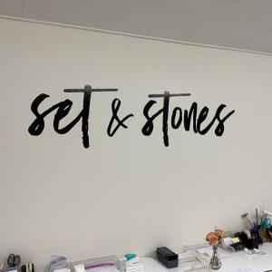 Wall graphics reading Set In Stone