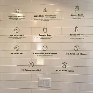 Applied vinyl wall graphics of a Plant Power Menu